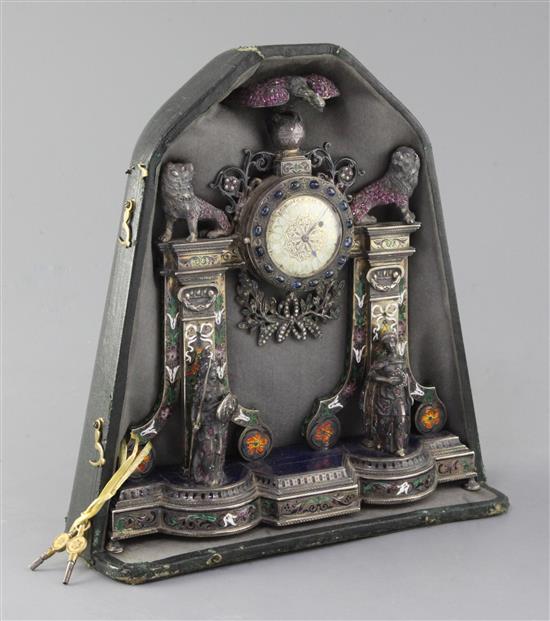 A good late 19th/early 20th century Austro-Hungarian silver gilt, polychrome enamel, lapis lazuli and gem set mantel timepiece.